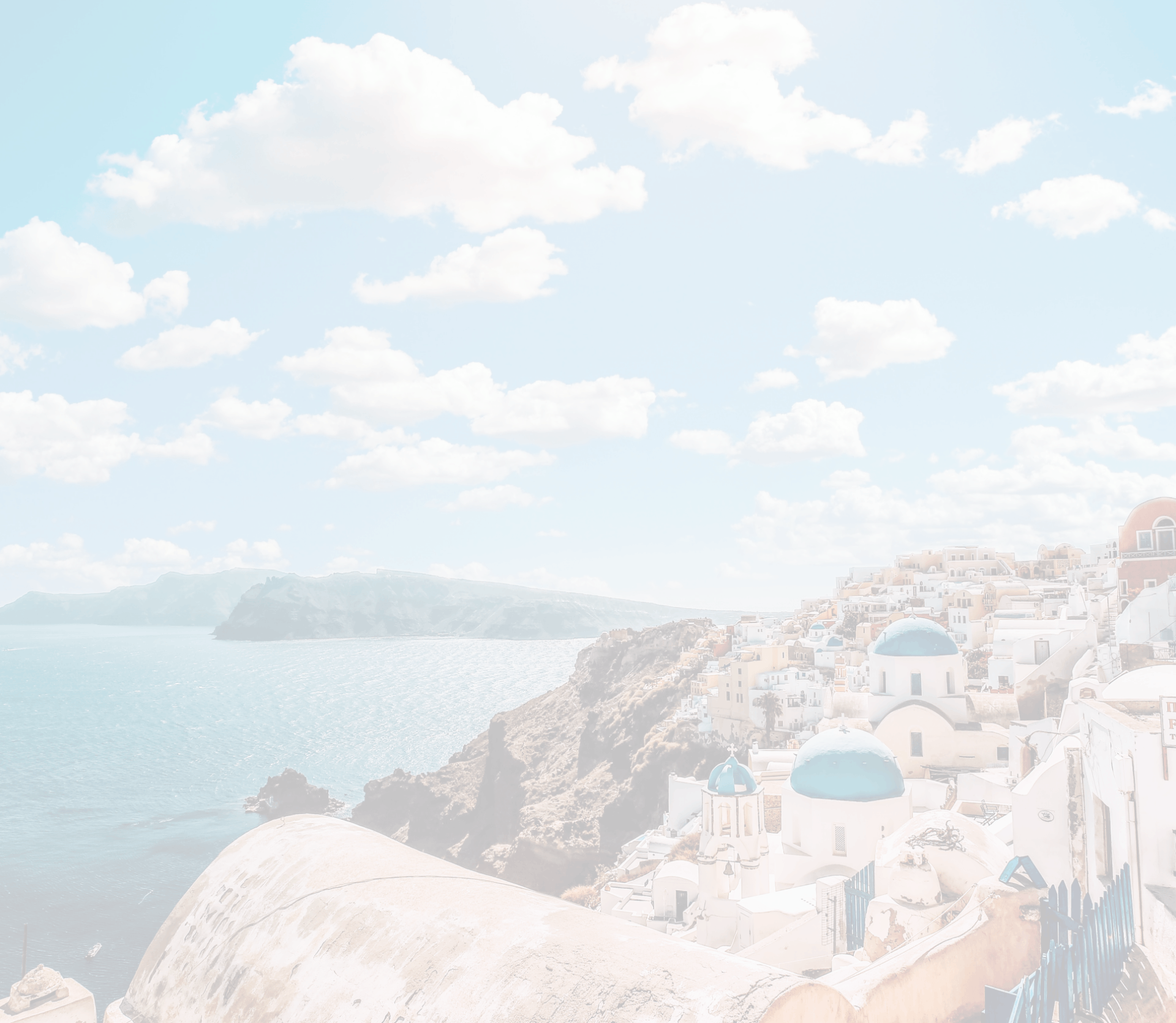 a seaside town with buildings with blue roofs