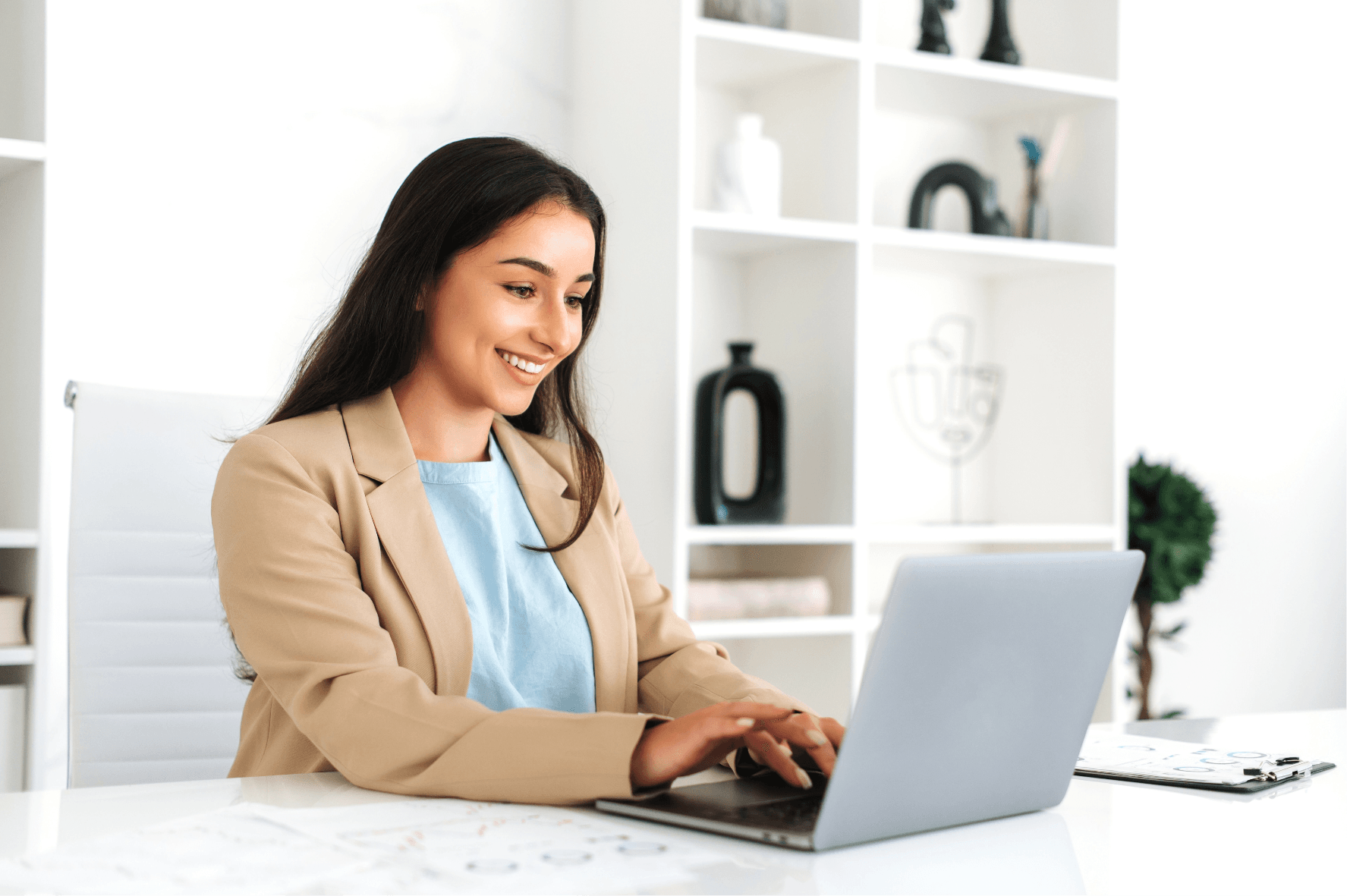 Woman typing on laptop