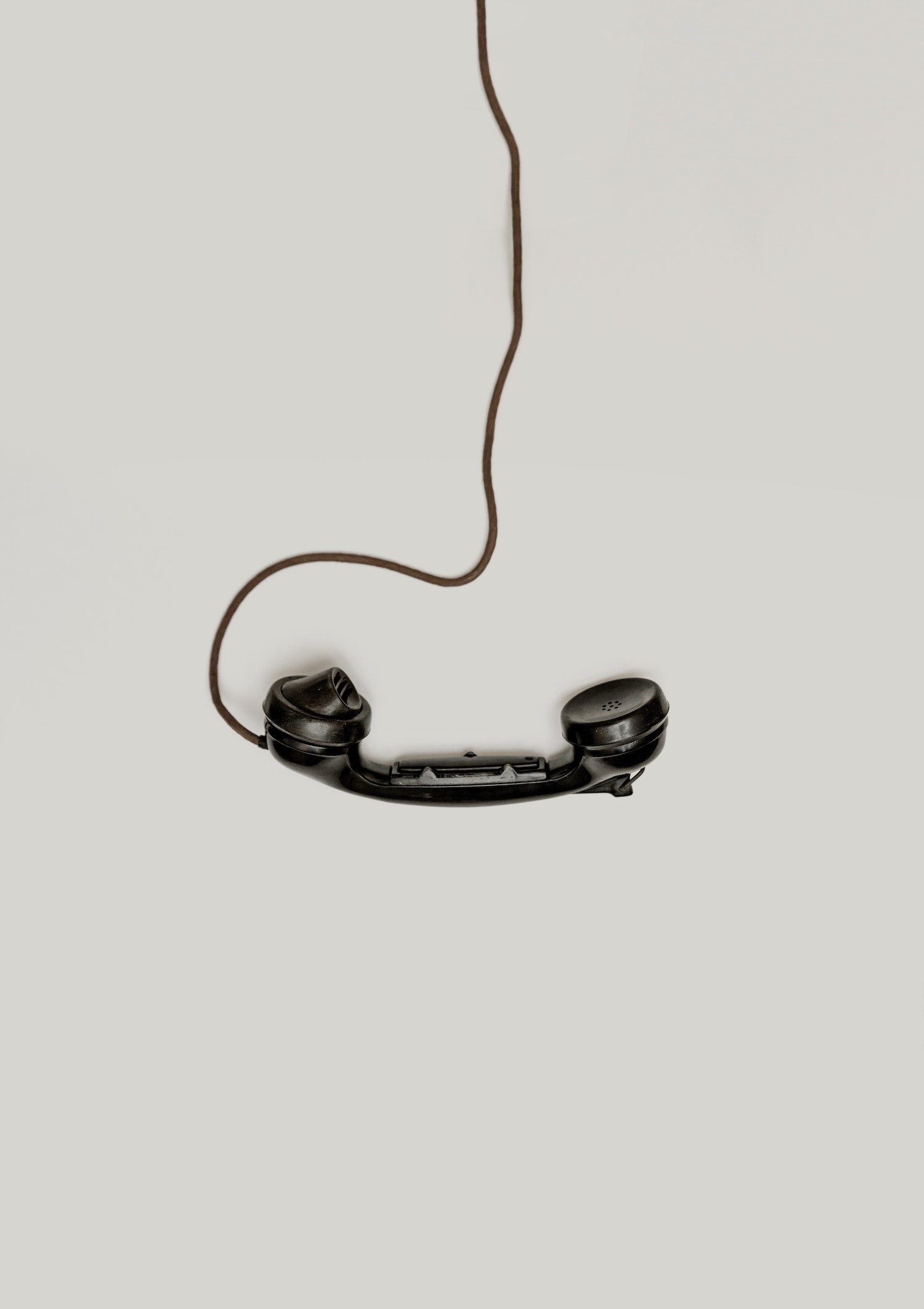 Corded phone hanging from top